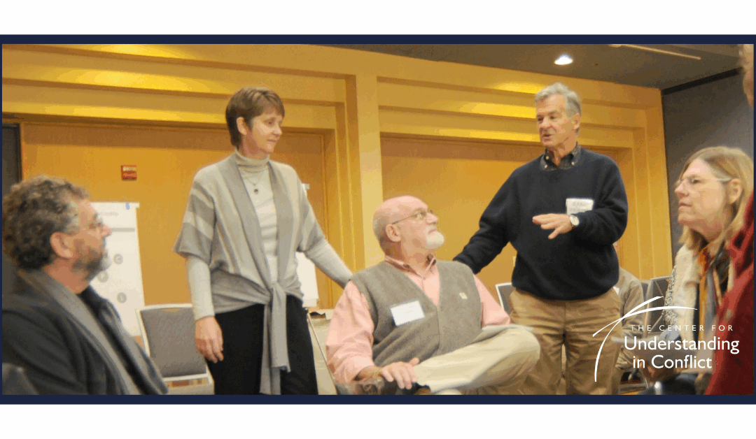 Photo of participants in a conference room.